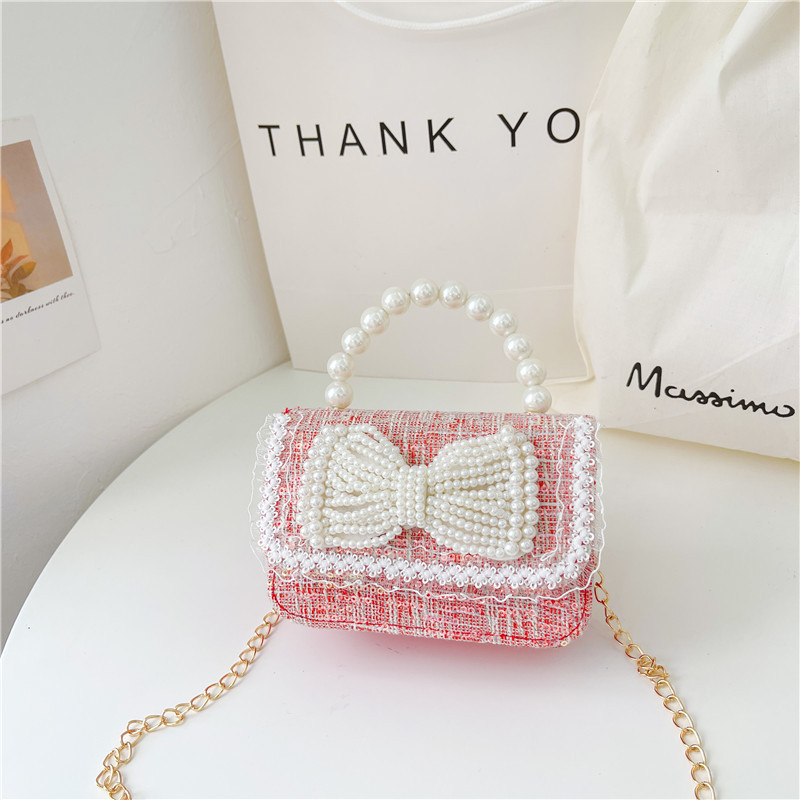 Nuevo bolso de los niños al por mayor Chunxi nuevo arco accesorios bolsa niña fuera monedero crossbody bolsa