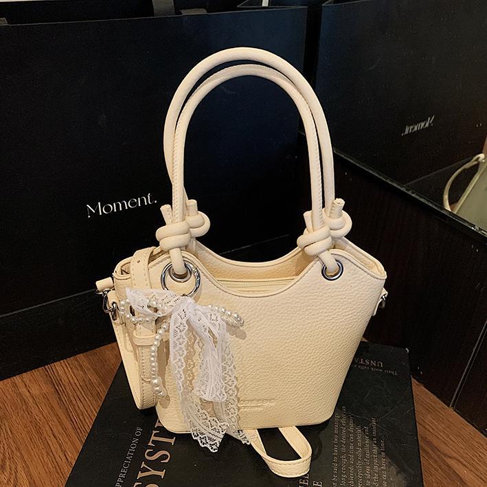 Bolso de cubo popular de este año para mujer 2025 nuevo bolso de mensajero de nicho de alta gama bolso de hombro de viajero súper caliente