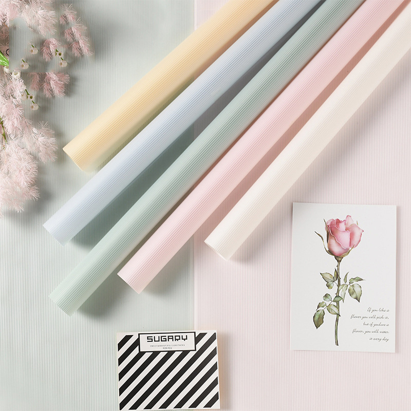 Fábrica de fiestas de flores al por mayor nueva línea de textura flor embalaje florista de color sólido papel de envoltura flor