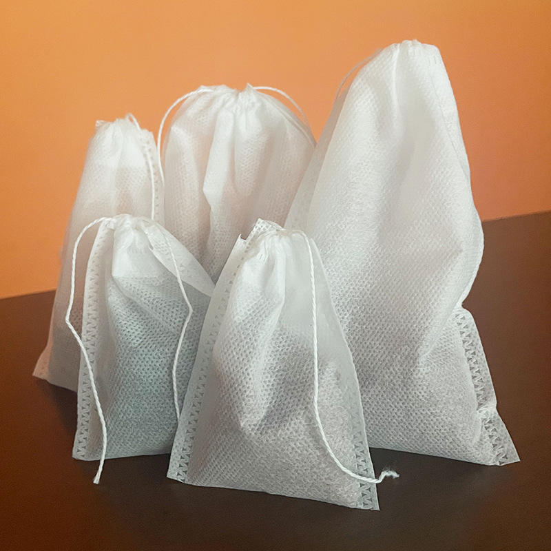 Especificaciones completas Tela no tejida desechable termosellado 100 piezas Bolsa de filtro termosellado Bolsa de bolsa de té Bolsa de decocción Bolsa de baño de pies