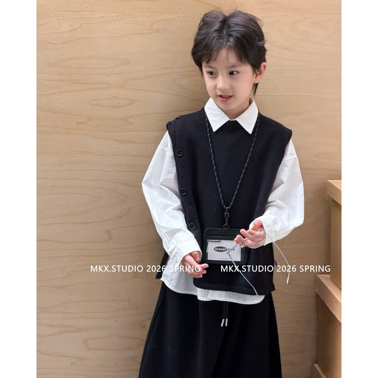 Suéter infantil camiseta de punto chaleco de punto para niños primavera y otoño 2026 ropa de niños de edad media chaleco de estilo universitario
