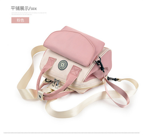 The Mommy bag is small and cute. It has a detachable front pocket and is a multi-functional baby bag. It is waterproof, lightweight, and has a crossbody design. It can be used to carry milk bags undefined