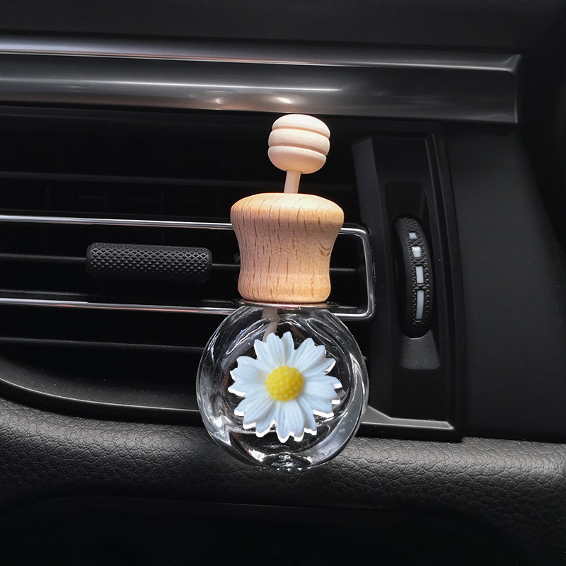 アクセサリーのペンダントの太陽の花の自動車の香水の空の瓶の噴出口の香水瓶はヒナギクの花の車の車内の装飾を挟みます。|undefined