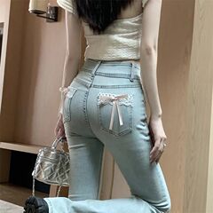 小さい女の子のギャルの蝶結びの微ラッパのジーパンの女性の春夏の新型の高い腰はやせている弾力の馬蹄のズボンのラッパのズボンを現します。