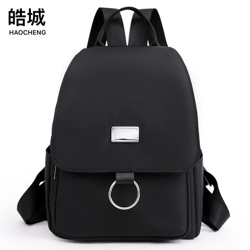 Comercio exterior al por mayor 2022 nuevas señoras casuales mochila de tela Oxford color sólido salvaje mochila de viaje urbano