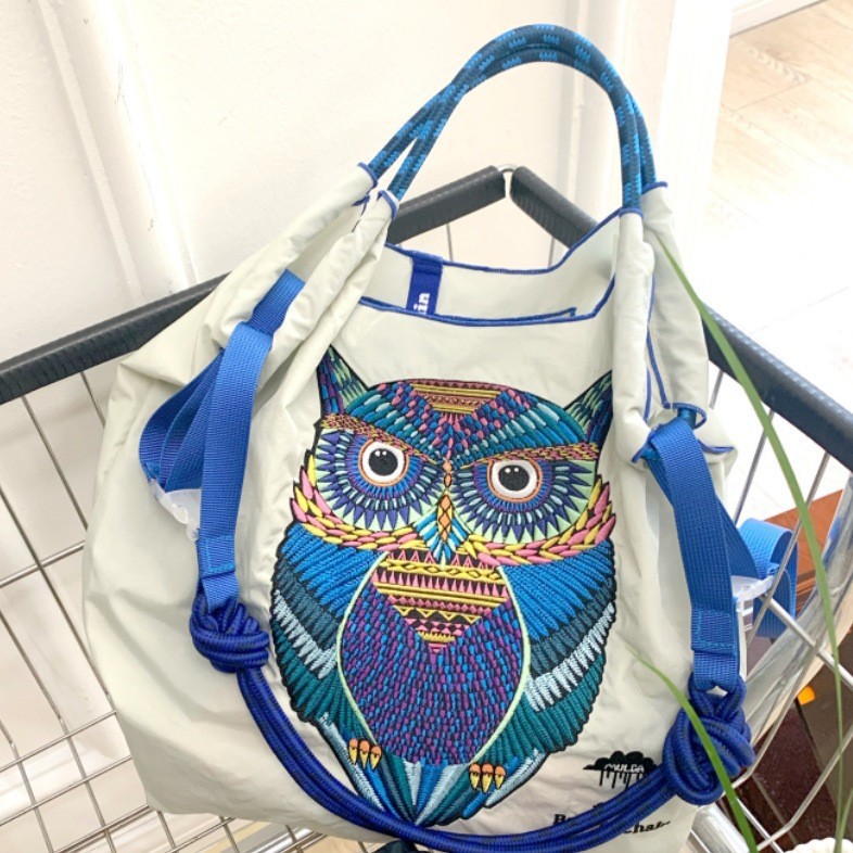 Light gray owl medium