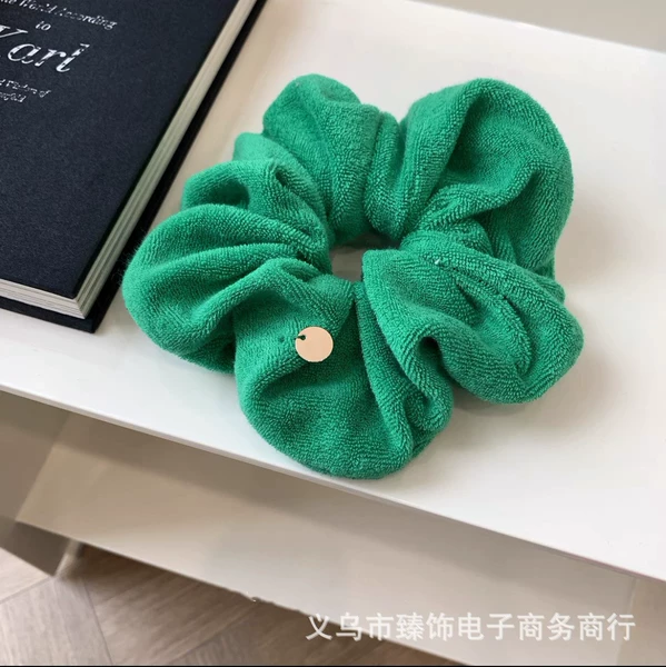 Green plush copper label