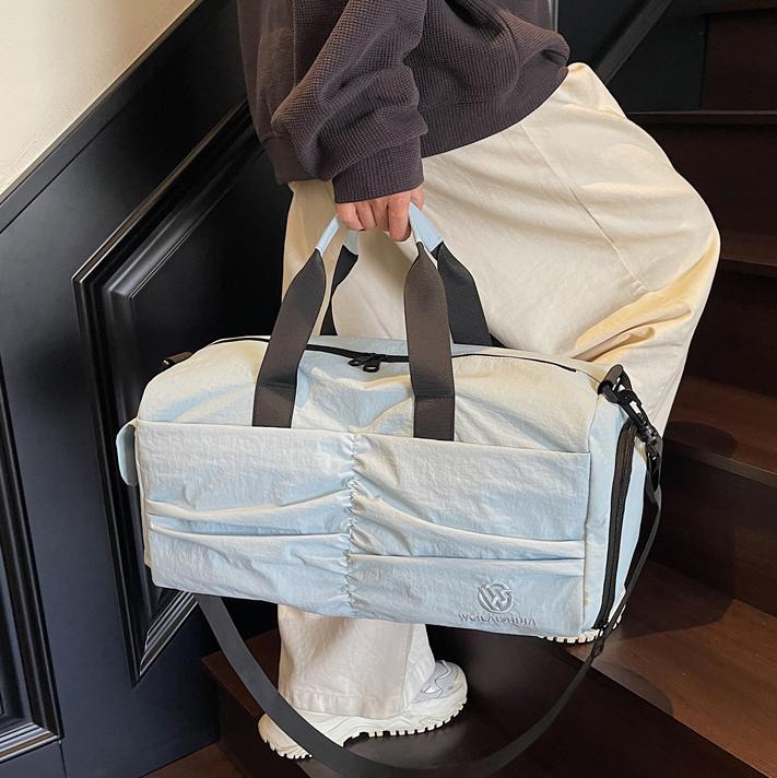 Bolso deportivo coreano transfronterizo femenino 2025 nueva bolsa de almacenamiento separada seca y húmeda bolsa de viaje de viaje