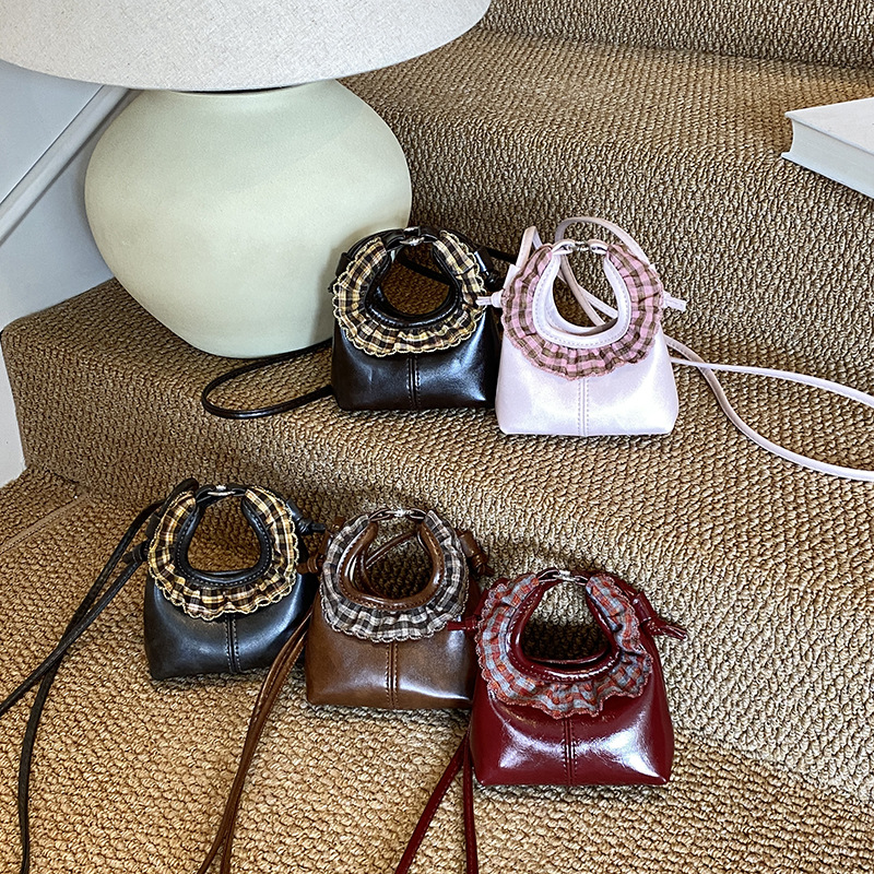 2025 otoño / invierno nuevo bolso infantil lindos bolsos de bebé de encaje redondo bolsos de mano mini niños de color sólido