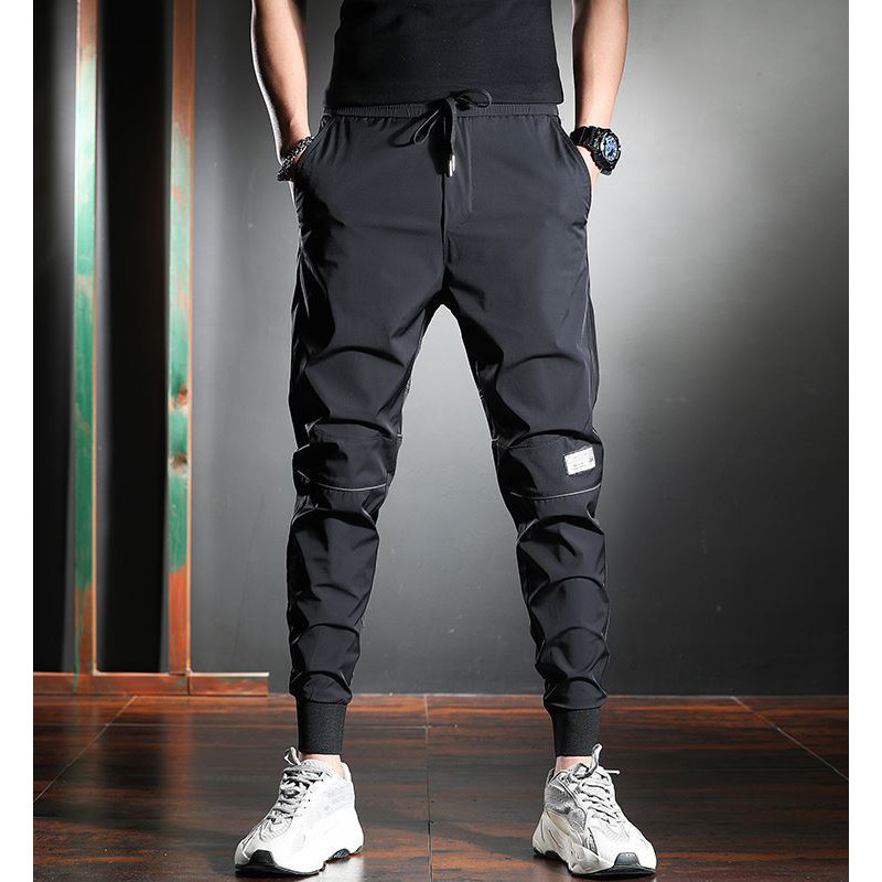 Pantalones deportivos casuales pantalones de secado rápido de cintura elástica fresca de estilo fino de verano para hombres