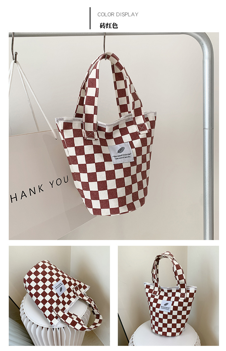A fashionable new Japanese and Korean chic black and white checkered canvas bag, a large-capacity single-shoulder bag for women, and a simple student handbag undefined