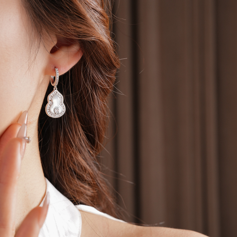 Pendientes de flor de lazo elegante de súper hada de plata Pendientes de moda de lujo ligero francés Pendientes de todo fósforo dulce de estilo literario