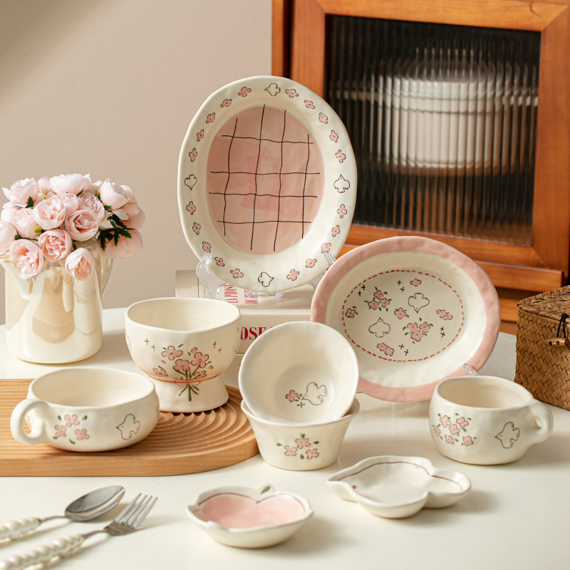 Cream-colored ceramic tableware set, hand-painted with floral and bird motifs, featuring cute bowls and plates for home use, perfect for breakfast, salads, and desserts Cream-colored ceramic tableware set, hand-painted with floral and bird motifs, featuring cute bowls and plates for home use, perfect for breakfast, salads, and desserts