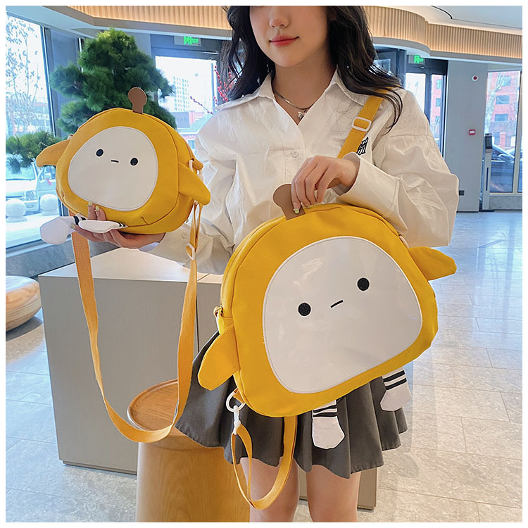 The new 2024 children's egg-shaped party backpack is a cute cartoon canvas single-shoulder bag and a fashionable and stylish small backpack undefined