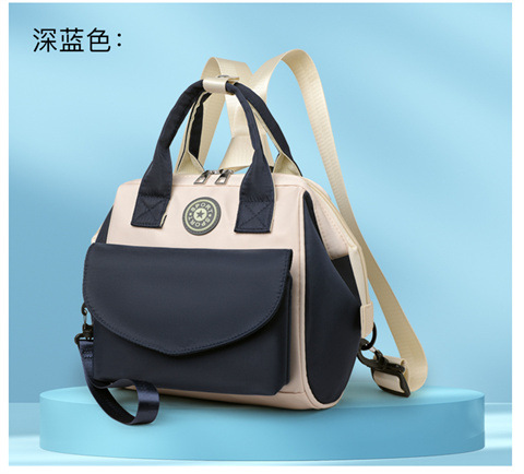 The Mommy bag is small and cute. It has a detachable front pocket and is a multi-functional baby bag. It is waterproof, lightweight, and has a crossbody design. It can be used to carry milk bags undefined