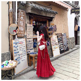 海边度假风红色波点连衣裙女装夏季2025新款系带收腰显瘦A字长裙