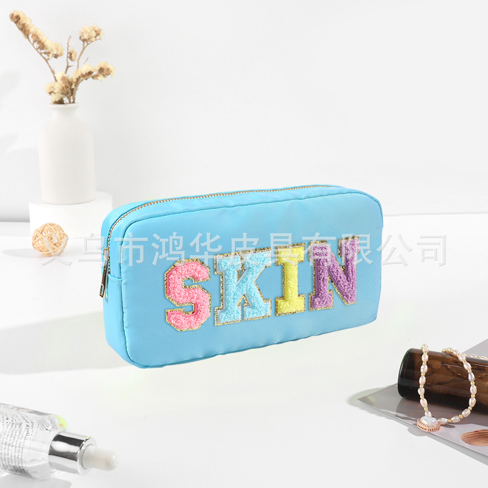 Transfronterizo amazon popular toalla bordada carta de nylon bolsa de cosméticos bolsa de almacenamiento de gran capacidad informal de las mujeres a prueba de agua