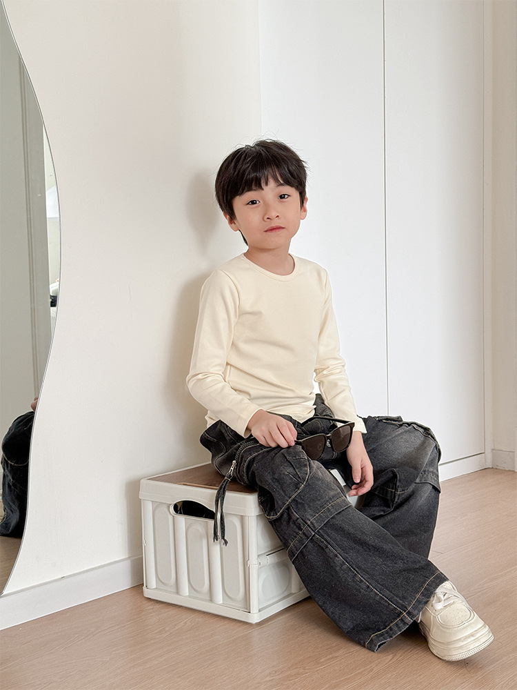 Camiseta de manga larga de algodón puro para niños 2026, camiseta básica para primavera y otoño, top cepillado de cuello redondo de color liso y corte holgado para niños y niñas.