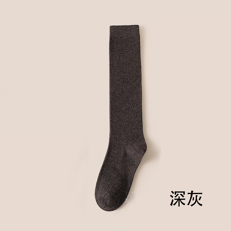 縦条のふくらはぎの靴下の女性の春秋の圧力の長い筒の靴下はやせていることができます。