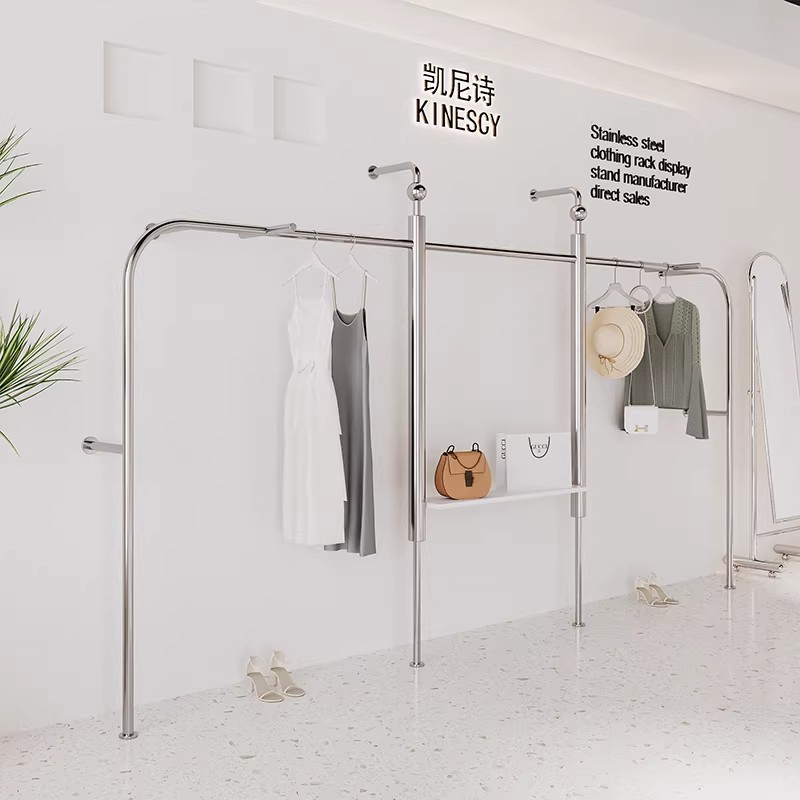 Estantes de exhibición de ropa tienda de ropa en línea estantes de ropa de acero inoxidable móviles tipo piso estante de exhibición de ropa de isla media image 5