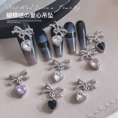 新商品の蝶結びの愛のペンダントのネイルアクセサリーは軽くて豪華です。