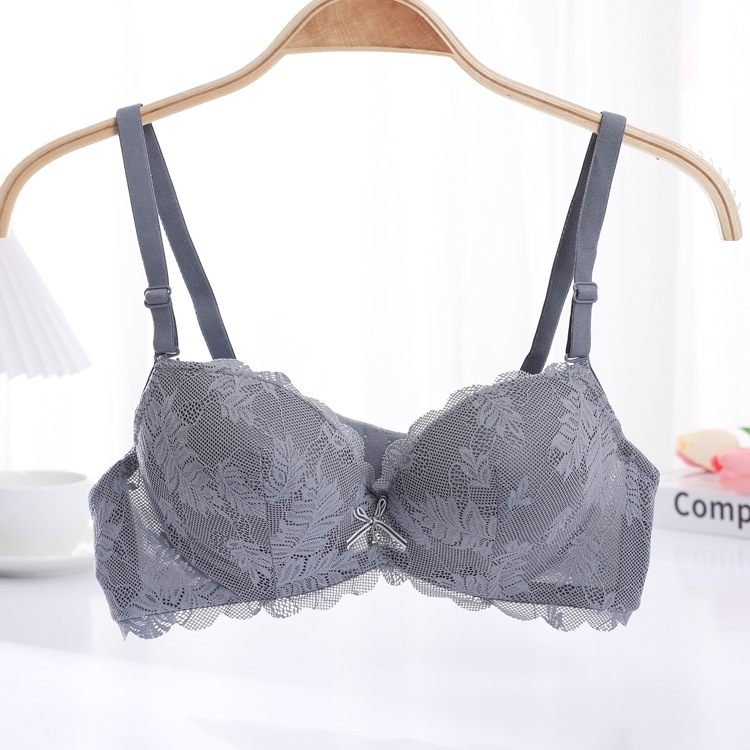 Fábrica de stock pequeño pecho grueso sujetador sexy encaje reunido ropa interior de mujer con anillo de acero sobre el bra de caída