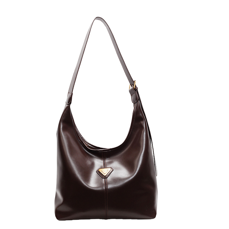 Bolsa de cuero suave universal de gran capacidad para mujeres 2024 nuevo bolso de hombro axilar simple de viaje universal bolsa de mano