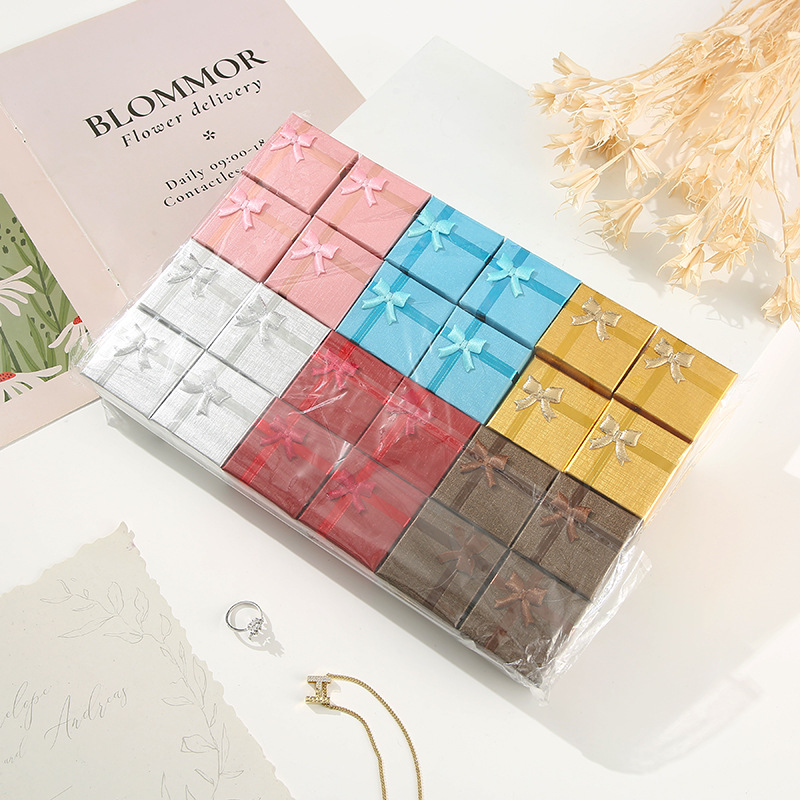 Moderno sistema minimalista de arco de color sólido caja pequeña caja de regalo de vacaciones caja de joyería hermosa caja de color mezcla al por mayor