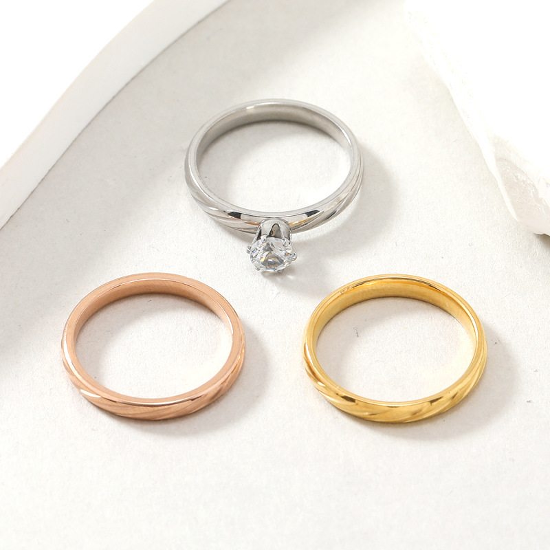 Hot selling titanium jewelry, real gold spherical surface batch flower diagonal inlay with zircon stainless steel couple_voghion.com