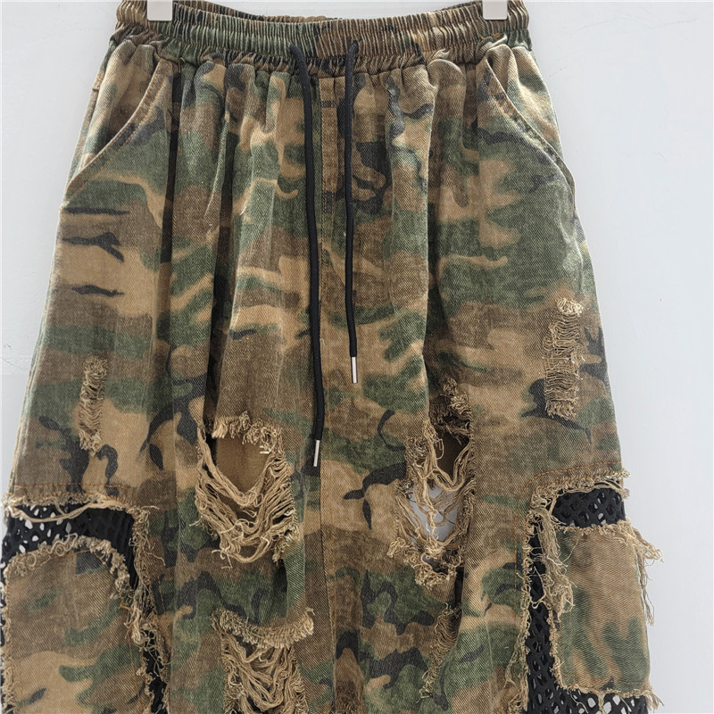 Personalidad nicho moda mujer 2025 verano nuevo estilo malla hueca costura nueve puntos camuflaje pantalones de entrepierna