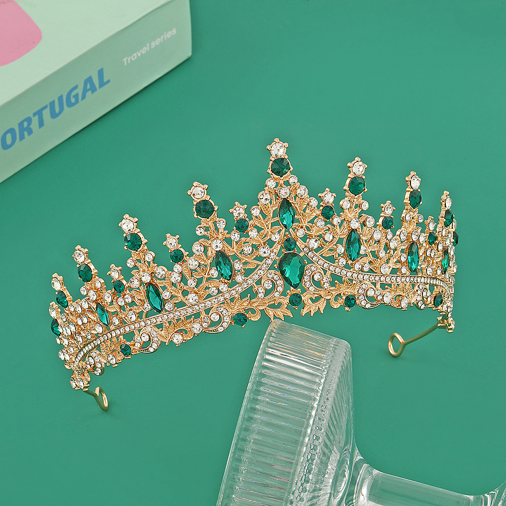 Corona de oro + diamante verde