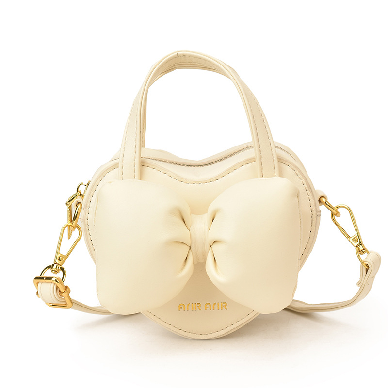 Mini lindos bolsos de mano en forma de corazón de melocotón, bolsos de hombro para bebés de color sólido, nuevos bolsos para niños transfronterizos