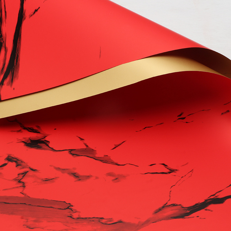 Huaxi comercio exterior transfronterizo mayorista oro lujo papel impermeable mármol oro papel de flor florista papel de embalaje