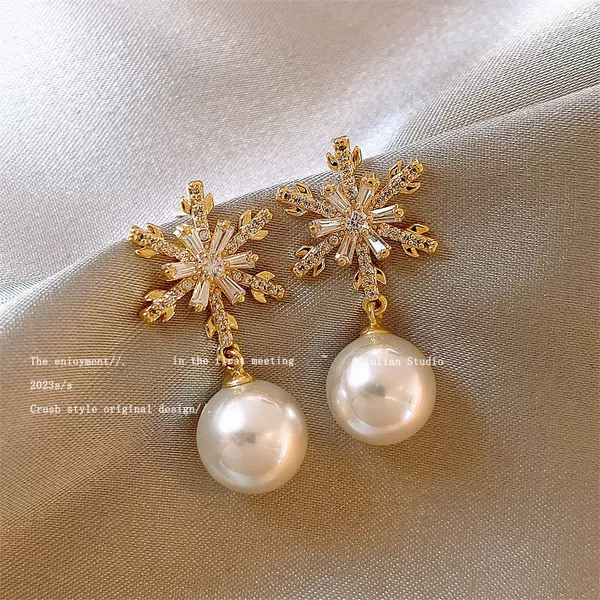 Golden diamond earrings from pearl, with snowflakes