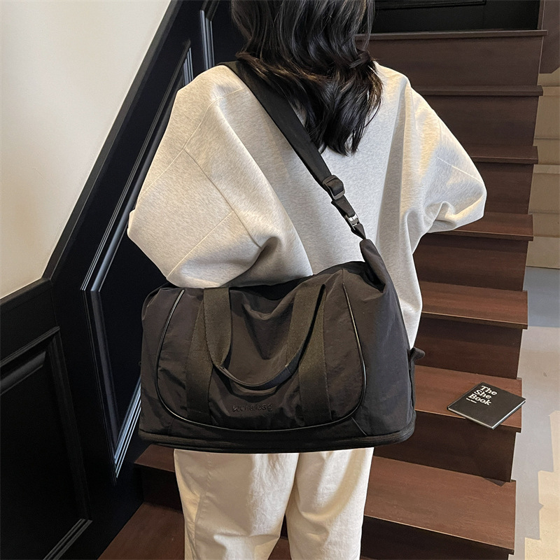 Bolso de viaje portátil coreano transfronterizo nuevo bolso de gimnasio ligero de gran capacidad bolso de viaje de viaje simple de ocio
