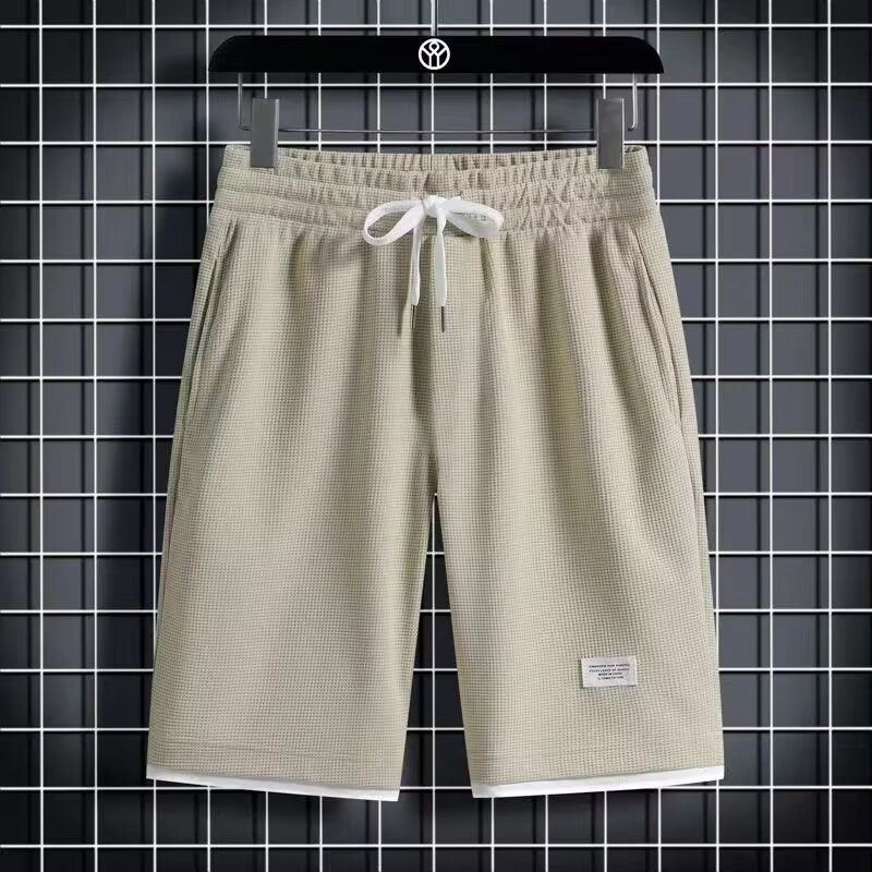 Camisa menos ropa Waffle pantalones de cinco puntos para hombres verano nuevo estilo estilo Hong Kong pantalones cortos de dos piezas falsos de color recto suelto
