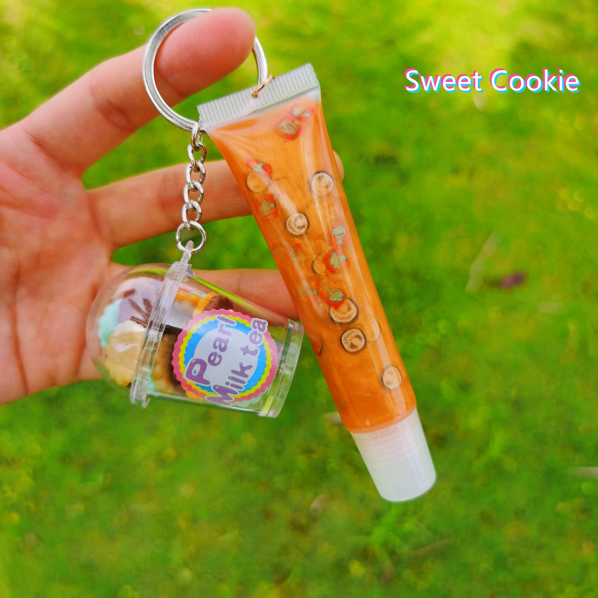 Shangxin niños cosméticos mecedora música llavero colgante tropical fruta niños piel bola colgante labio esmalte no lo
