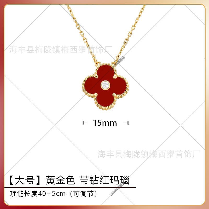 Large four-leaf clover necklace in gold and red mother-of-pearl with diamonds in the middle