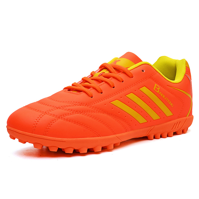 Zapatos de fútbol en stock, zapatos de entrenamiento anti-deslizante para niños, respirados y amortiguados, zapatos de entrenamiento juvenil
