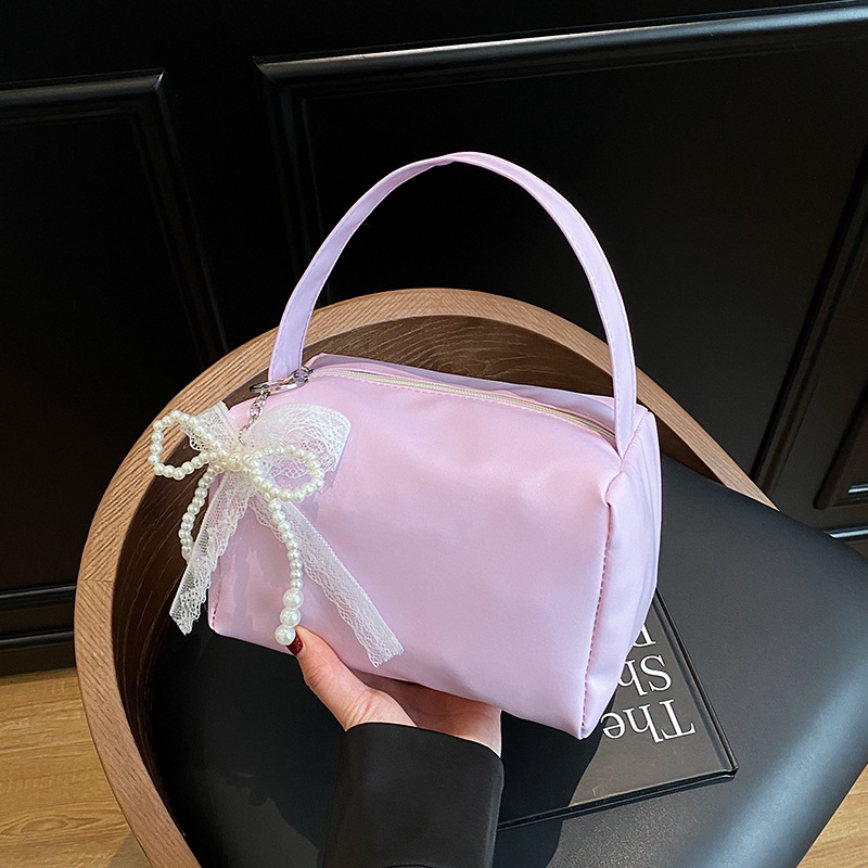 Bolsas de brazo populares de este año, bolsas de moda de moda coreana, bolsas pequeñas de primavera y verano 2025, bolsas de mujer casuales de nicho de moda.