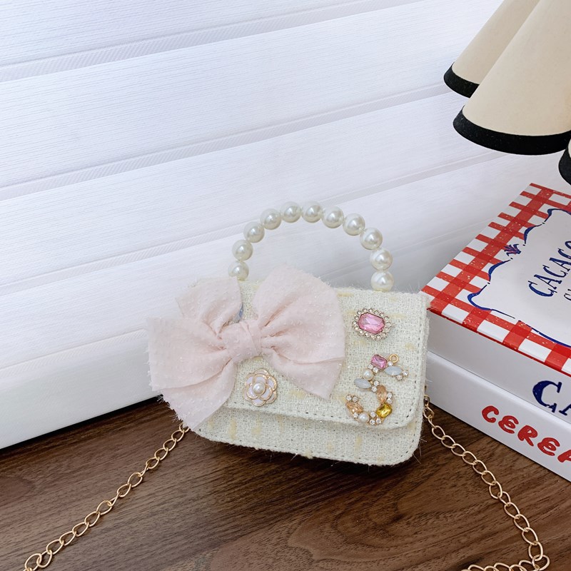 Bolso de cinturón para niños bolso de cambio pequeño viento perla de moda bolso de arco bolso de niña linda