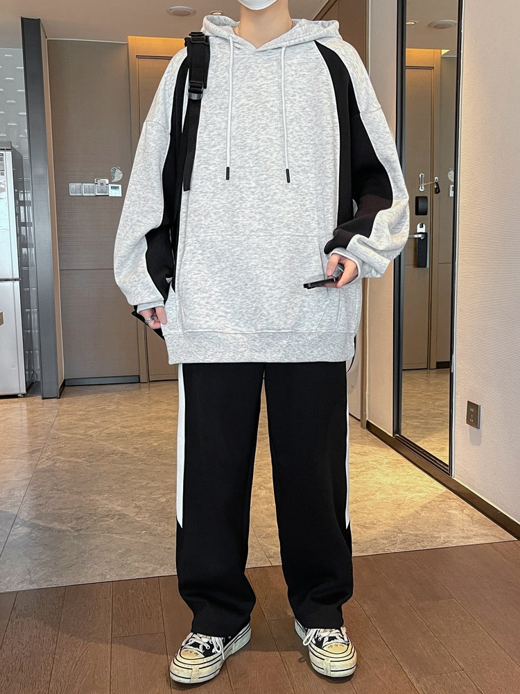 Primavera y otoño nuevo conjunto de dos piezas de chaqueta con capuz para niños jóvenes sueltos tendencia de hombre guapo con un conjunto completo