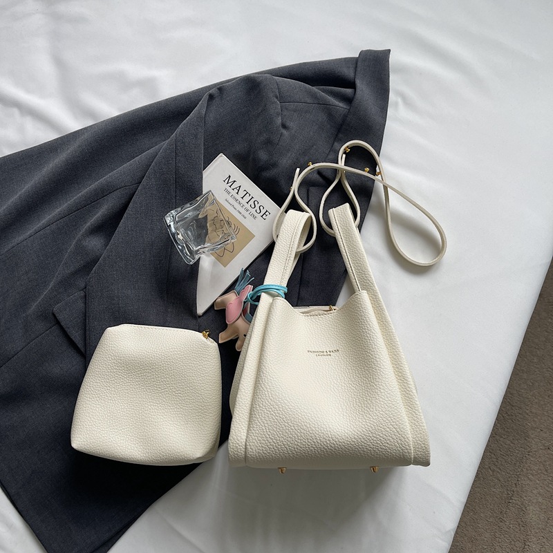 Este año popular simple bolso de cubo portátil para mujeres 2026 nuevo estilo de alto nivel lichi estampado lujoso mochila de hombro