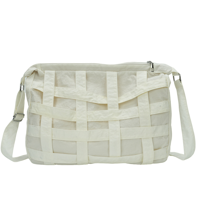 Bolso de mensajero de diseño de nicho 2024 nuevo bolso de hombro tejido hueco tridimensional bolso de hombro de gran capacidad para viajeros