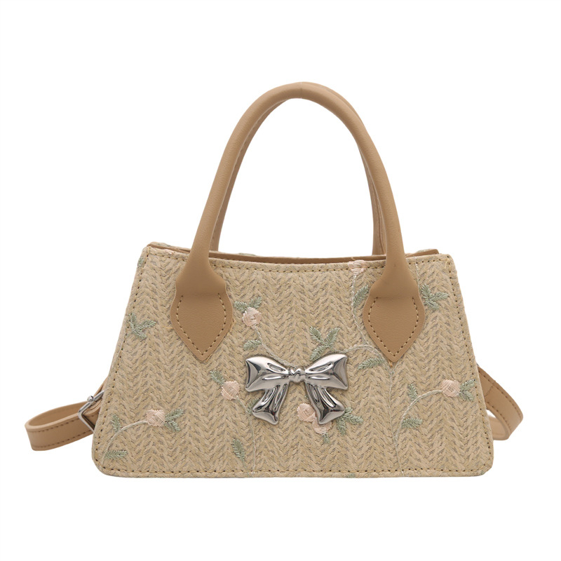 Moda de tejido de paja de primavera y verano 2025 nueva tendencia de encaje de paja estilo occidental bolso de mensajero de un solo hombro femenino