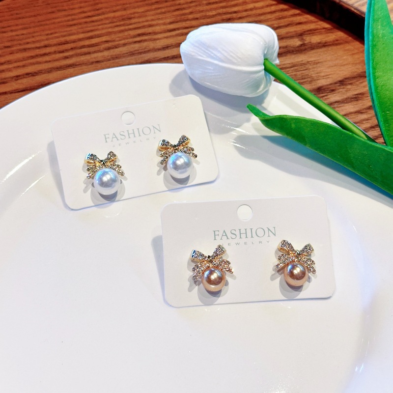 Korean bow pearl studded diamond temperament, niche, light luxury, high-end design, earring earrings_voghion.com