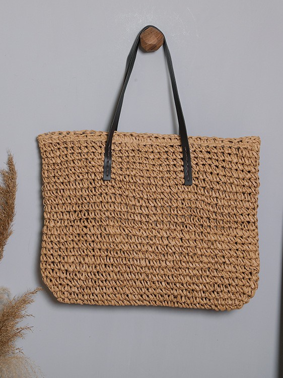 capacious woven straw shoulder bag