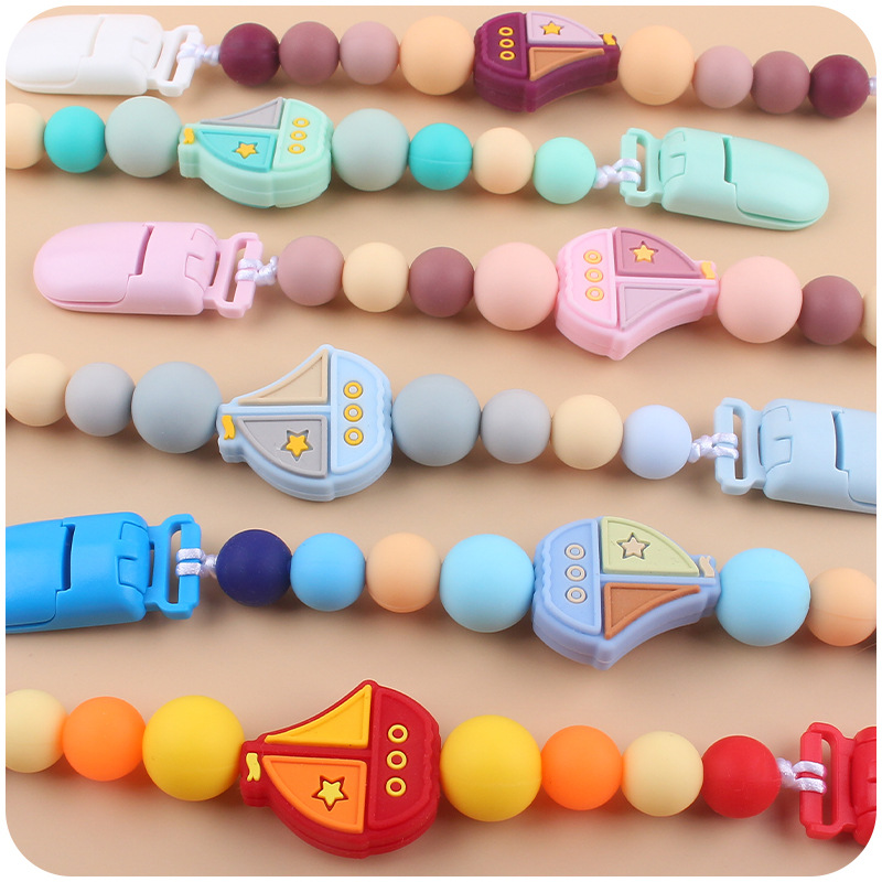 Suministros para bebés chupete Cadena de dibujos animados creativa vela mordedura de silicona cadena anti-gota molar Nuevo