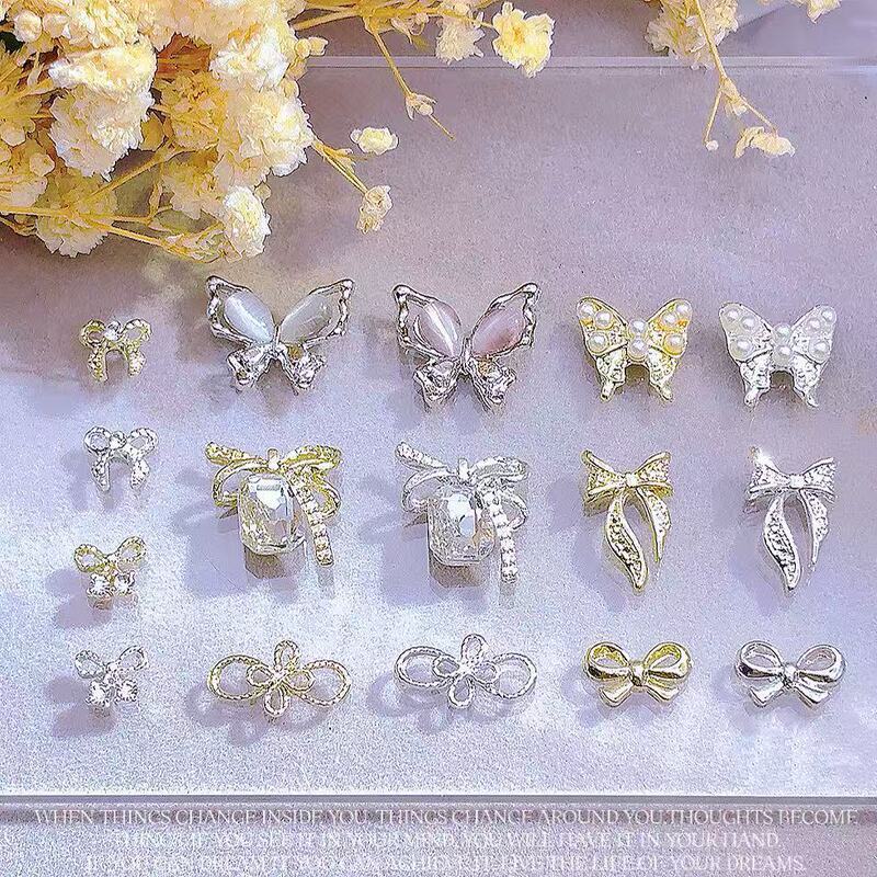 New Cat's Eye Butterfly Nail Jewelry Alloy Three-dimensional Hollow Four-leaf Clover Simple Bow Tie Nail Decoration New Cat's Eye Butterfly Nail Jewelry Alloy Three-dimensional Hollow Four-leaf Clover Simple Bow Tie Nail Decoration