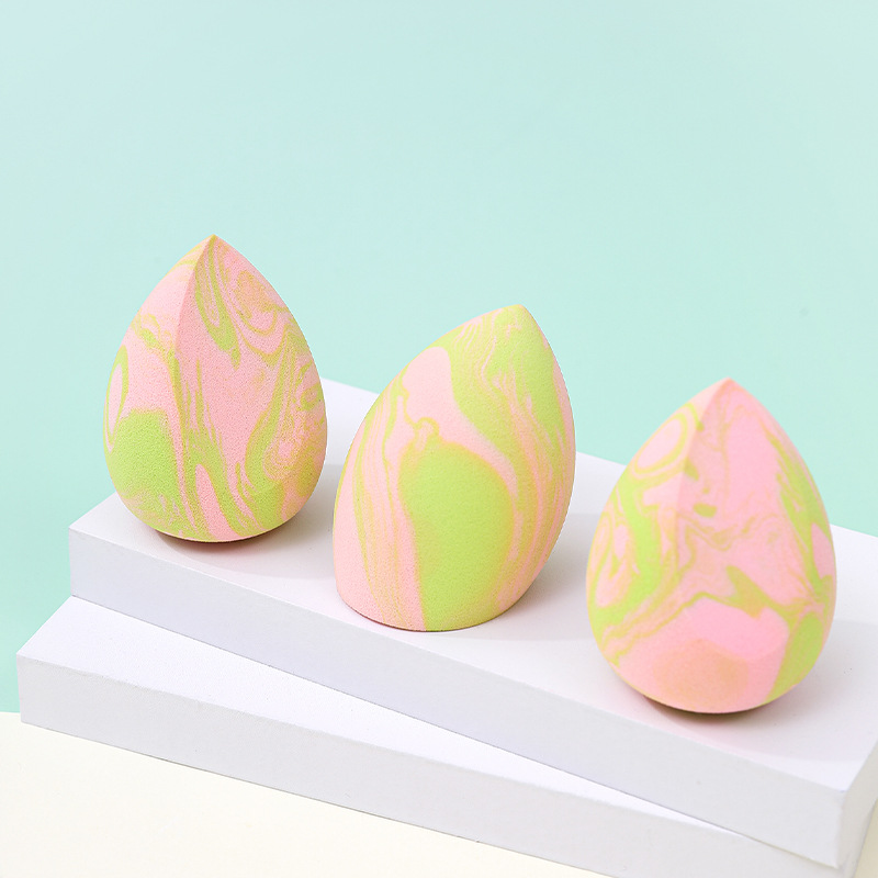 La borla de polvo de huevo de belleza de color mixto transfronterizo se agranda cuando se encuentra con el agua, gotas de agua sin látex, esponja de maquillaje en forma de calabaza, personalización de fábrica de huevos
